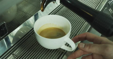 Process of making espresso in a coffee machine. Barista male hands making coffee Stock-Footage 136335960