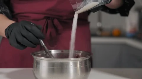 Process of making filling for dessert. Mass of cherry and sugar is mixed Stock Footage 111151919