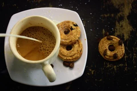The process of making flat white coffee by pouring steam milk into a cup of e Stock Photos