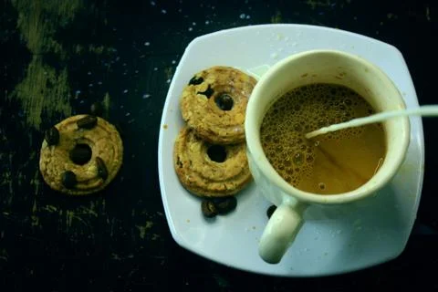 The process of making flat white coffee by pouring steam milk into a cup of e Stock Photos