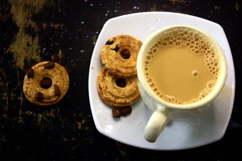 The process of making flat white coffee by pouring steam milk into a cup of e Stock Photos