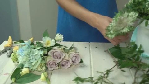 Process of making a flower composition in a flower box close-up 4k. Stock Footage 80359401