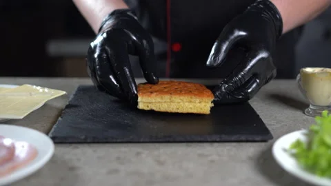 The process of making focaccia with turkey ham in the kitchen. close-up of a Video stock 152752739