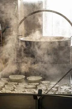 Process of making fresh white soft ricotta whey cheese on small cheese farm i Stock Photos