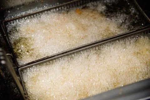 Process of making fried chicken on the kitchen. Restaurant, cafe or pizzeria  Stock Photos