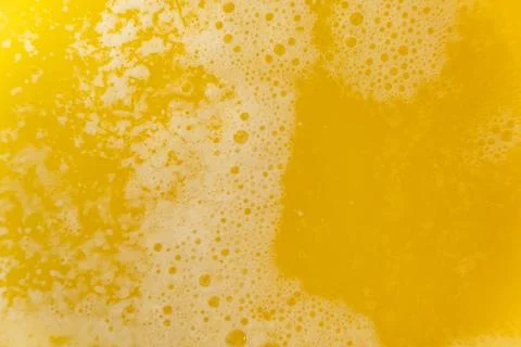 The process of making ghee from butter, macro texture. Stock Photos