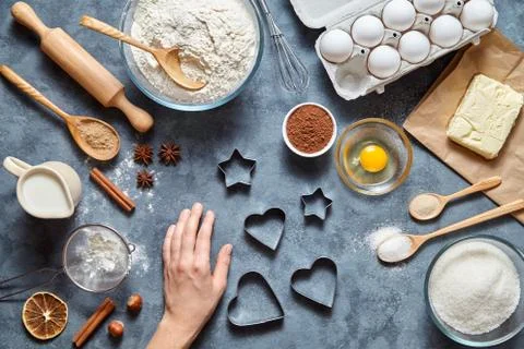 The process of making ginger cookies heart on Valentine's Day. Woman' hand ready Stock Photos