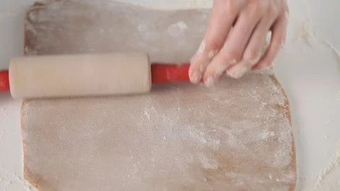 Process of making gingerbread cookies for Christmas. A woman is preparing a Stock Footage 121119458