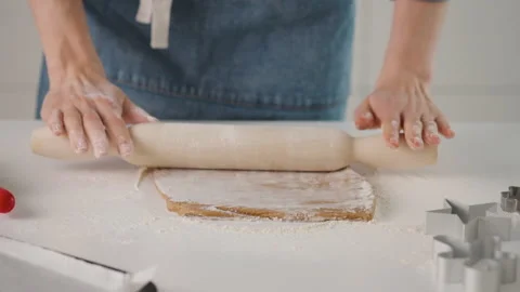 Process of making gingerbread cookies for Christmas. A woman is preparing a Stock Footage 131776226