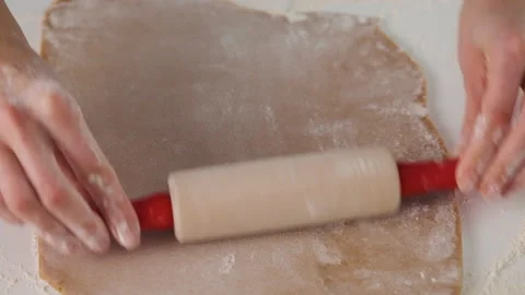 Process of making gingerbread cookies for Christmas. A woman is preparing a Stock Footage 141648947