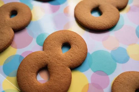 The process of making gingerbread for March 8. Cut out figure eights from dough Stockfoto's
