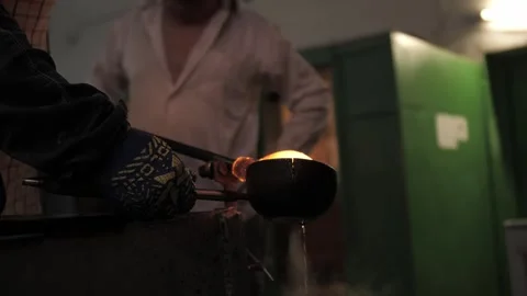 The process of making glass decor with glassblower Stock Footage 273783096