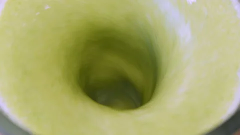 The process of making a green vegetarian healthy smoothie: in the recipe spinach 库存影片 178486034