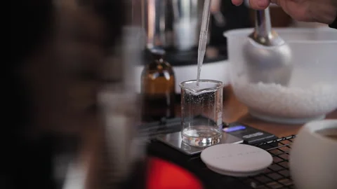 Process of making handmade candles, pipette the candle perfume into a beaker Stock-Footage 256207672