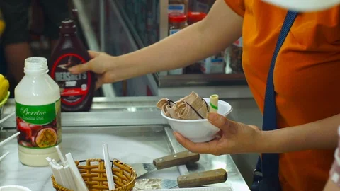 Process of making a handmade fruit icecream on an asian night market Stock Footage 86542889