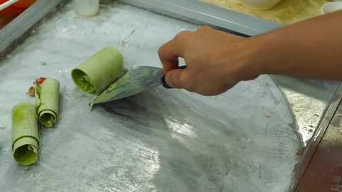 Process of making a handmade fruit icecream on an asian night market Stock Footage 86544091
