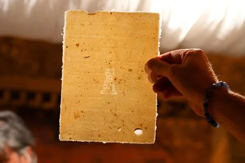 The process of making handmade paper. Traditional papermaking workshop. Stock Photos
