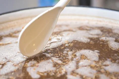 Process of making home beer from malt. Kraft beer from barley and dark malt Stock Photos