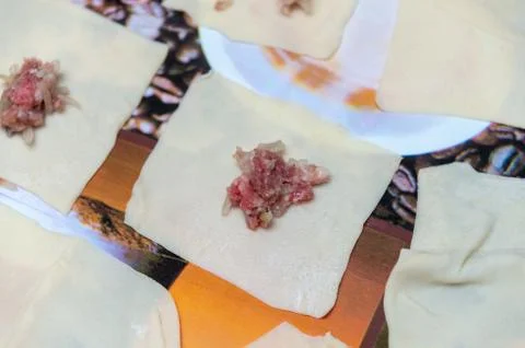 The process of making home-made dumplings. Raw homemade dumplings on a wooden Stock Photos
