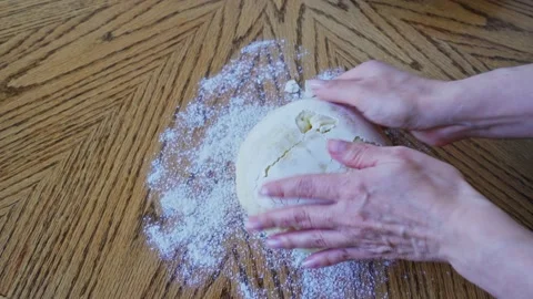 The process making homemade bread. Baker put the dough out of the bowl and roll 動画素材 202274274