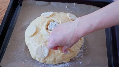 The process making homemade bread. baker decorate bread festive loaf dough Stock Footage 203742096