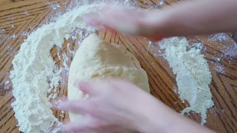 The process making homemade bread. baker knead the dough by female caucasian 動画素材 204852760
