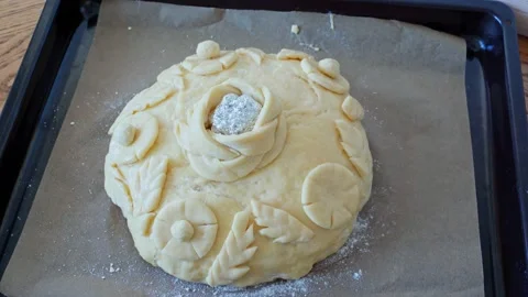 The process making homemade bread loaf. Baker decorate bread festive loaf dough Stock Footage 204852689