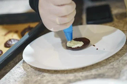 Process of making homemade chocolate chip cookies: the dough is laid out on a Stock Photos