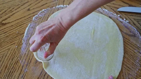 The process making homemade cookie. Cut out circles from the dough with a glass Stock Footage 202274682