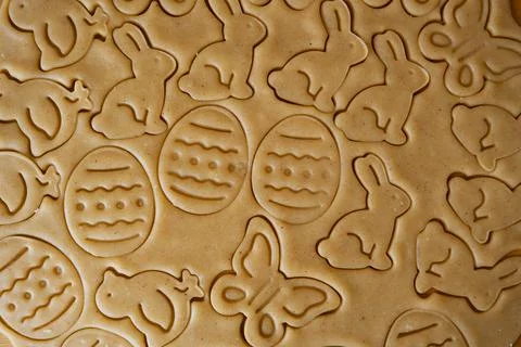 The process of making homemade Easter cookies from the dough using cutout mol Stock Photos