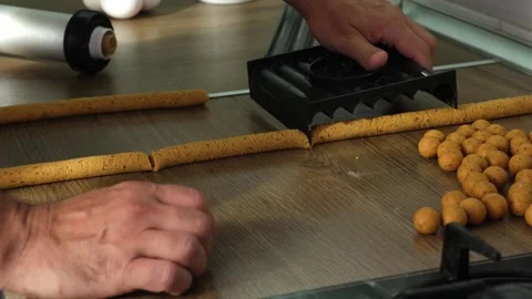 Process of making homemade fresh boilies for carp fishing, slices the dough Video stock 241197072