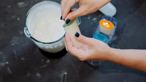 The process of making homemade  ice cream with a blender and molds Stock Footage 126602874