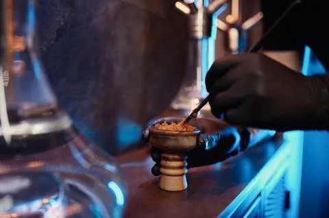 Process of making hookah for smoking closeup view Stock Photos