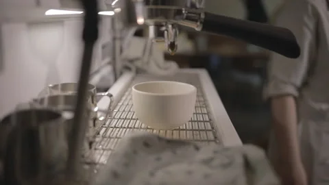 Process of making hot coffee in a coffee machine. Barista making fresh coffee in Video stock 234939018