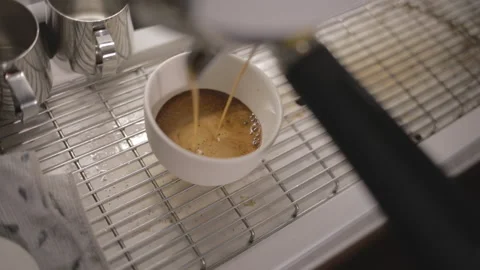 Process of making hot coffee in a coffee machine. Barista making fresh coffee in Video stock 234939167