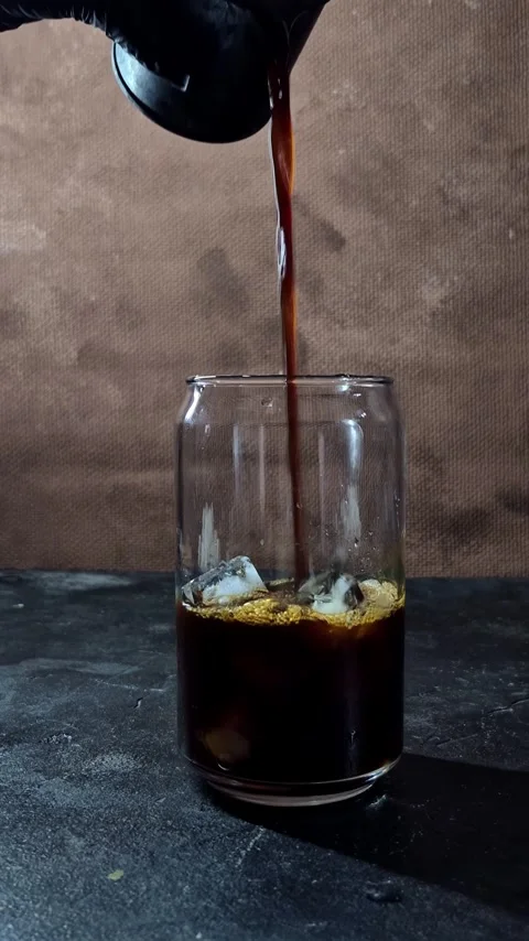 The process of making an iced latte in a glass Stock Footage 305062686