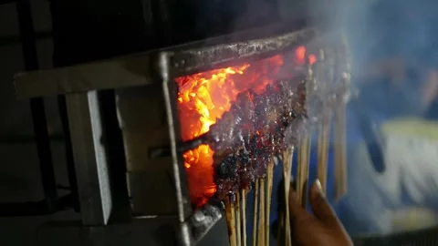 The process of making Indonesian chicken satay in traditional way using cha.. Stock Footage 294279995
