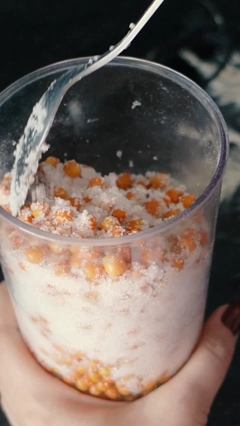 Process of making jam from yellow sea buckthorn berries and sugar close-up Stock Footage 286324256