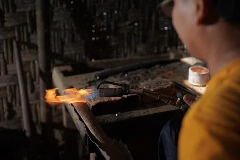 The process of making keris is done manually and traditionally Stock Photos