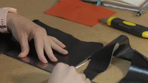 The process of making a key holder from leather. Marking and cutting Stock Footage 169285729