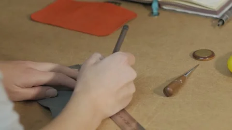 The process of making a key holder from leather. Fasteners for a key holder. Stock Footage 169285730