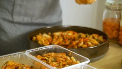 Process of making kimchi. Close up of a pair of hands folding cabbage kimch.. Stock Footage 272465370