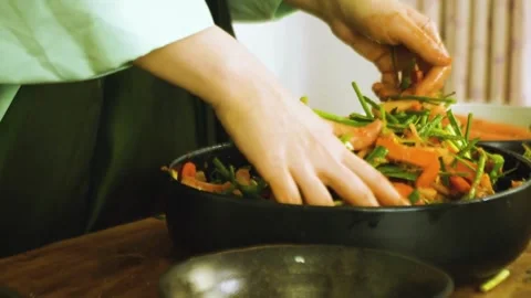 Process of making kimchi. Close up of a pair of hands folding cabbage kimch.. Stock Footage 272465473