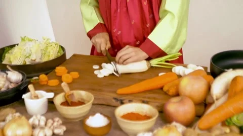 Process of making kimchi. Close up of a pair of hands folding cabbage kimch.. Stock Footage 272466080