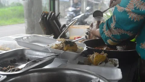 The process of making Kupat Tahu typical of Indonesian traditional food Stock Footage 221888768