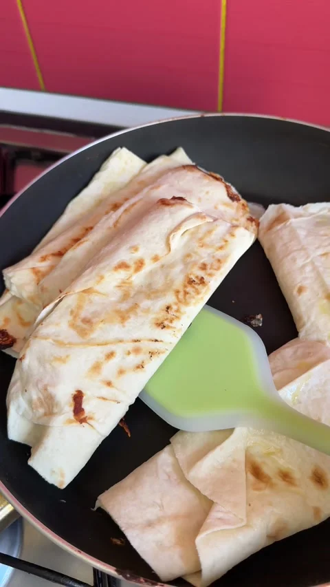 Process of making lavash with cheese Cook is adding hard cheese on pita. Process Stock Footage 317221743