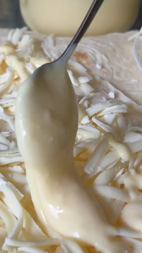 Process of making lavash with cheese Cook is adding hard cheese on pita. Process Stock Footage 323456011