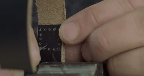 The Process Of Making A Leather Strap With A Needle And Thread. Cinema 4k Stock Footage 121588040