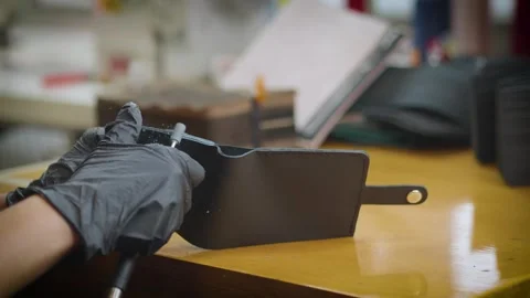 The process of making a leather wallet Stock Footage 266139668