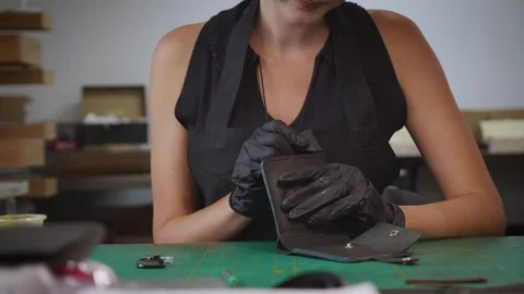 The process of making a leather wallet Stock Footage 266139791